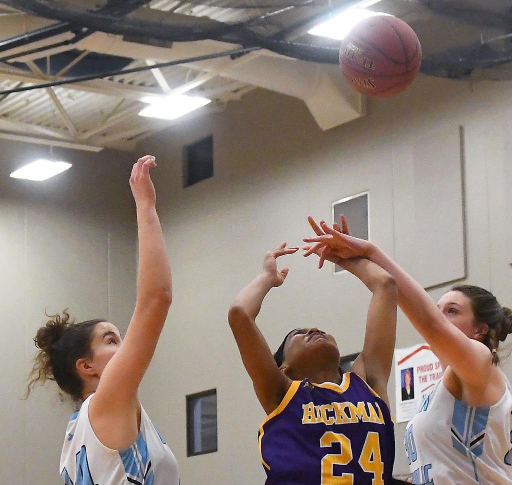 Detriann'a Jamison is blocked by Tolton's Maggie McGuire